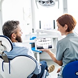 Man visiting his La Porte implant dentist