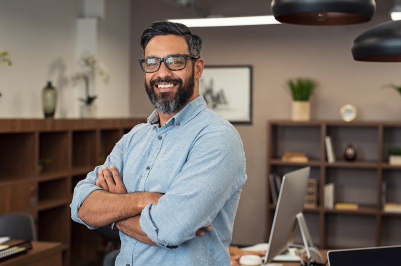 Smiling man in office