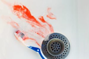 toothpaste swill with blood in it
