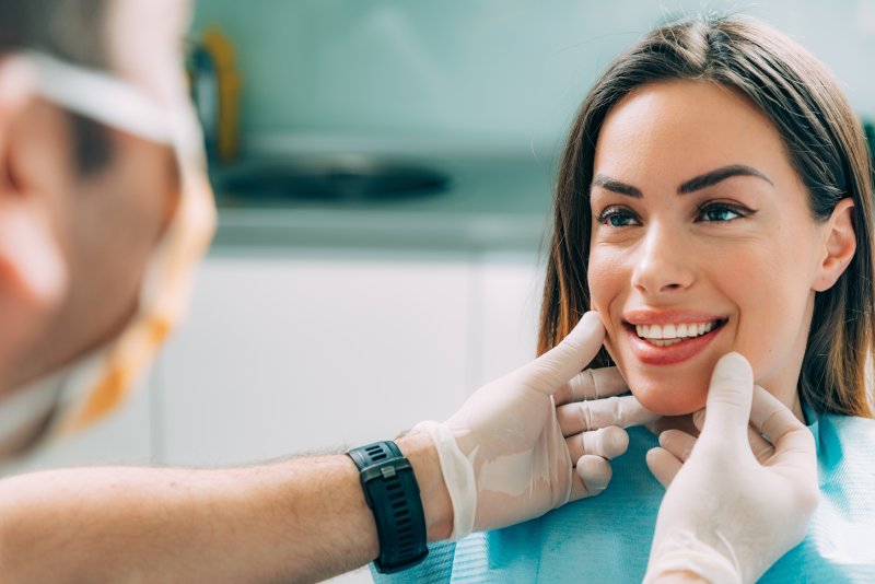 A dentist assessing his patient for cosmetic dentistry