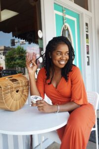 Smiling woman sitting outdoors