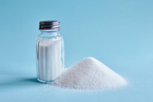 Table salt against a blue background